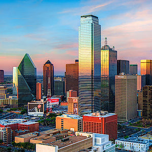 City skyline with tall buildings during sunset